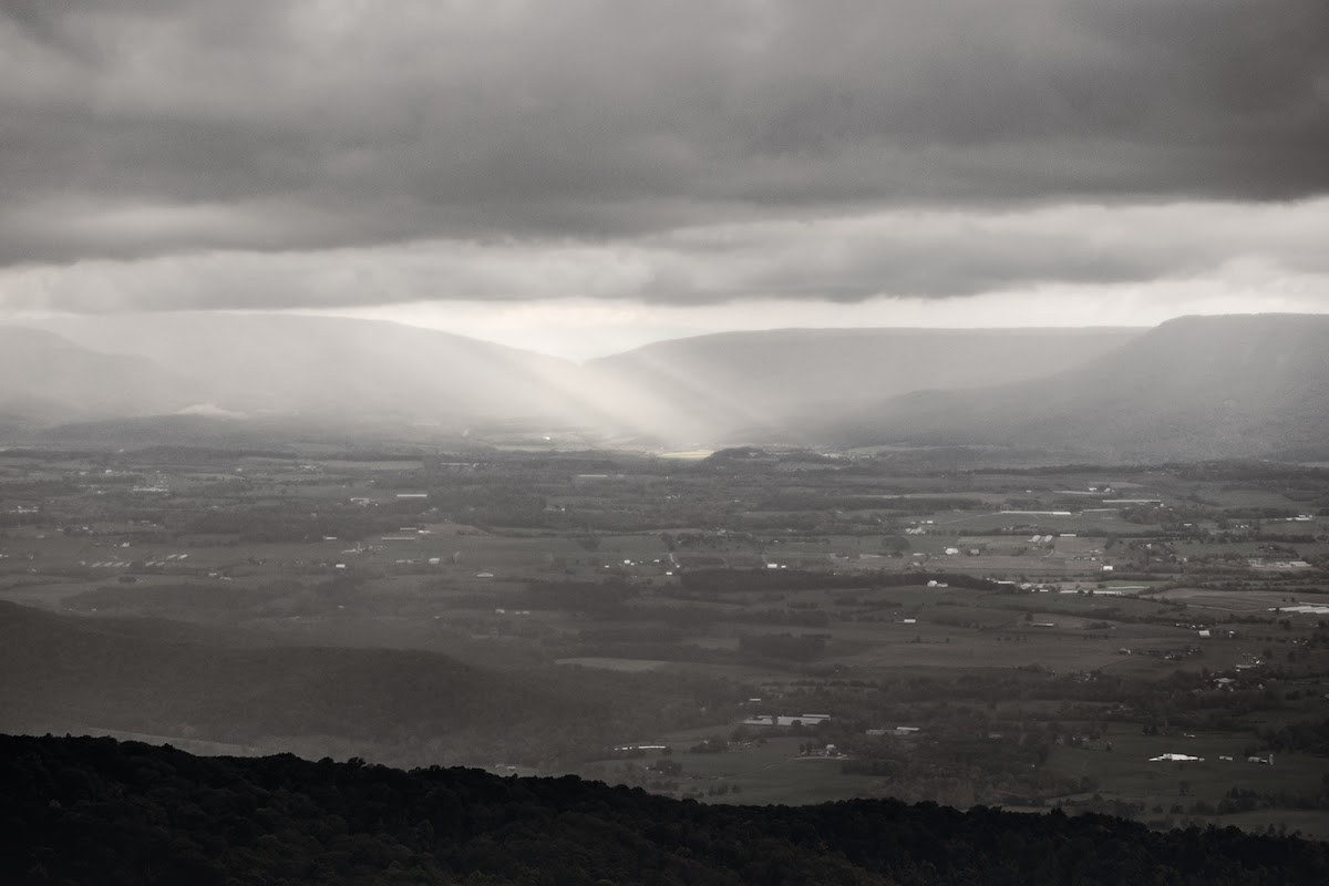 Sunbeams breaking through heavy storm cloud over the Shenandoah valley