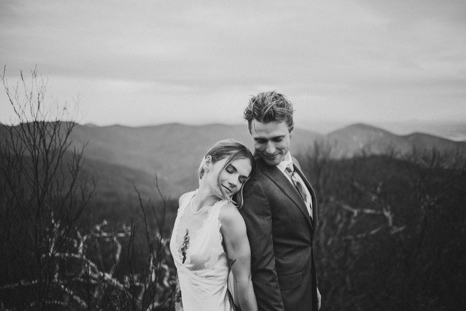 Amanda and Austin on a Blue Ridge overlook at dusk, in black and white