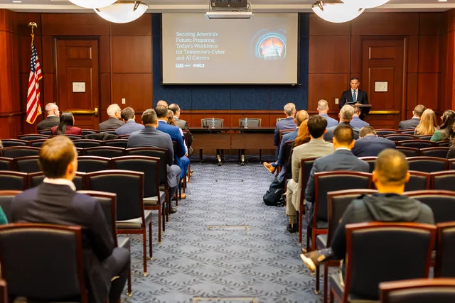 Center aisle leads to the distant speaker.