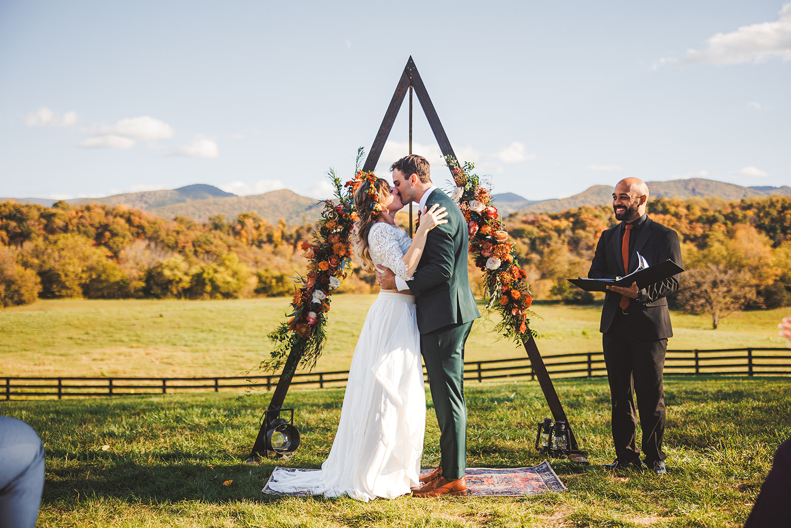 Sara and Ryan's ceremony arch against the Blue Ridge at Rivers Bend Ranch