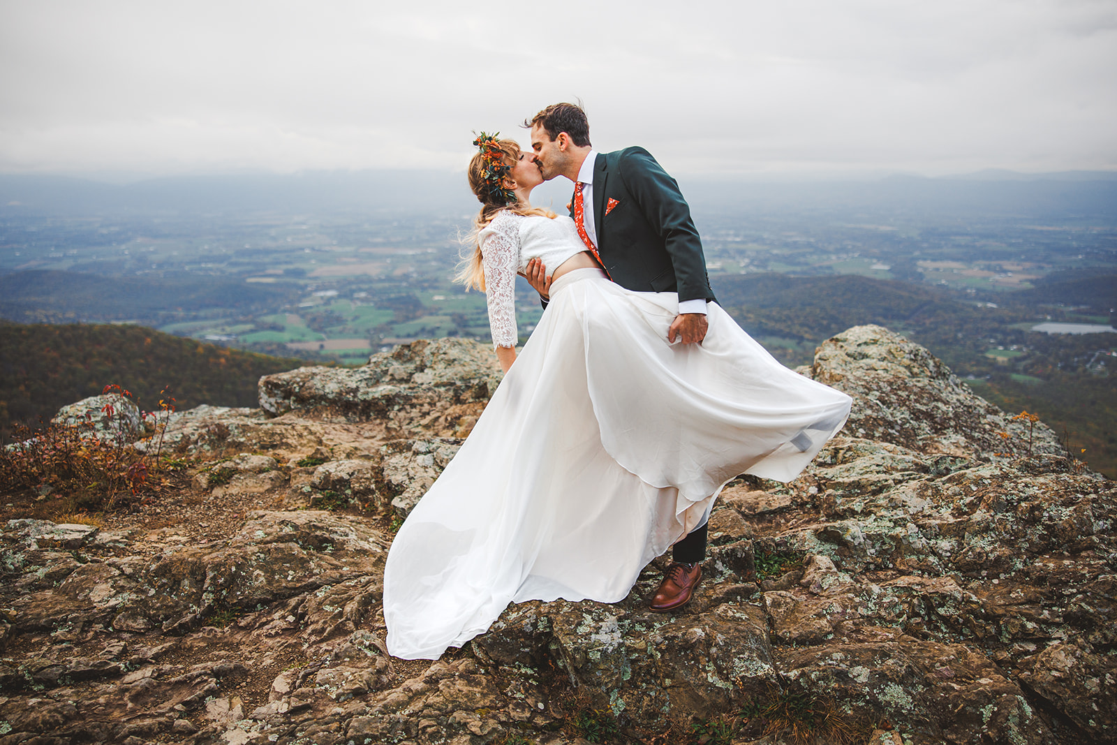 Ryan dipping Sara for a kiss on a rock outcrop above the Shenandoah Valley, her skirt catching the wind and farmland far below